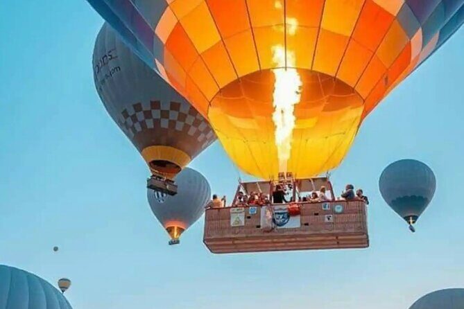 Cappadocia Hot Air Balloon with Pickup, Breakfast & Champagne - The Fairy Chimneys flight: about 1 hour over iconic views