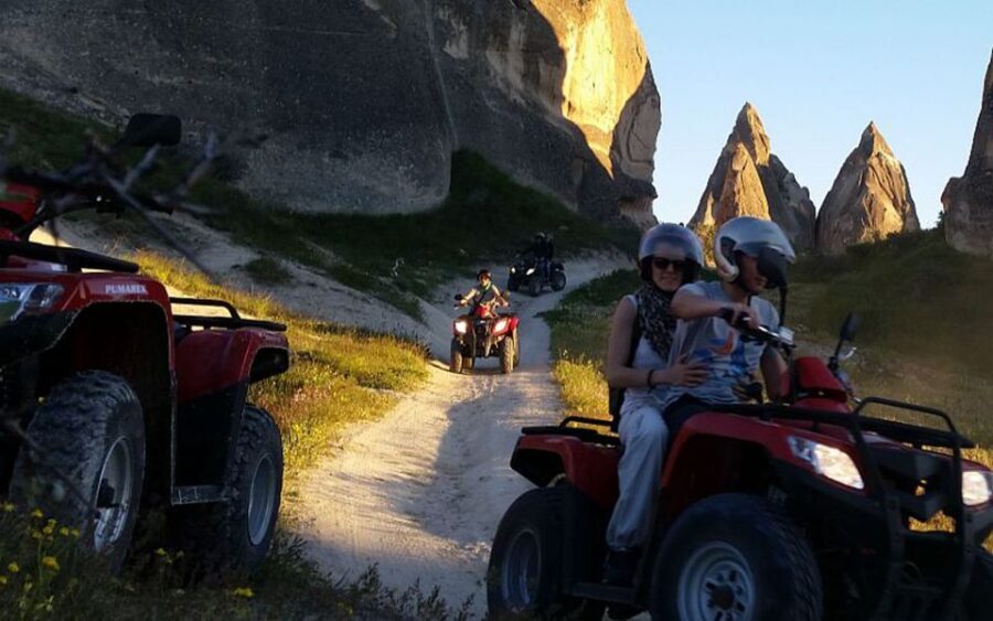 From Göreme: Cappadocia Valleys at Sunset ATV Tour - Red Valley: the convoy ride that makes fairy chimneys feel real